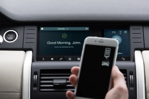 A Land Rover driver uses the Tile app to locate essential objects before departing.