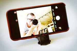 Me, shooting a photo of my phone that's running the front camera, in a Pocket Tripod. This has to be one of the most self-referential selfies ever taken.