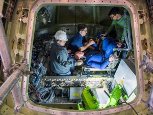 Crash-test dummys installed in the Orion mock-up prior to a splashdown test / Image courtesy of NASA/David C. Bowman