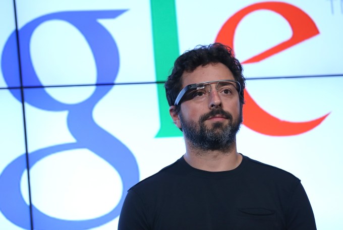MOUNTAIN VIEW, CA - SEPTEMBER 25: Google co-founder Sergey Brin looks on during a news conference at Google headquarters on September 25, 2012 in Mountain View, California. California Gov. Jerry Brown signed State Senate Bill 1298 that allows driverless cars to operate on public roads for testing purposes. The bill also calls for the Department of Motor Vehicles to adopt regulations that govern licensing, bonding, testing and operation of the driverless vehicles before January 2015. (Photo by Justin Sullivan/Getty Images)