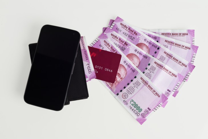 Top View of New Indian Currency Notes of 2000 With Mobile Phone, Wallet and Credit Cards