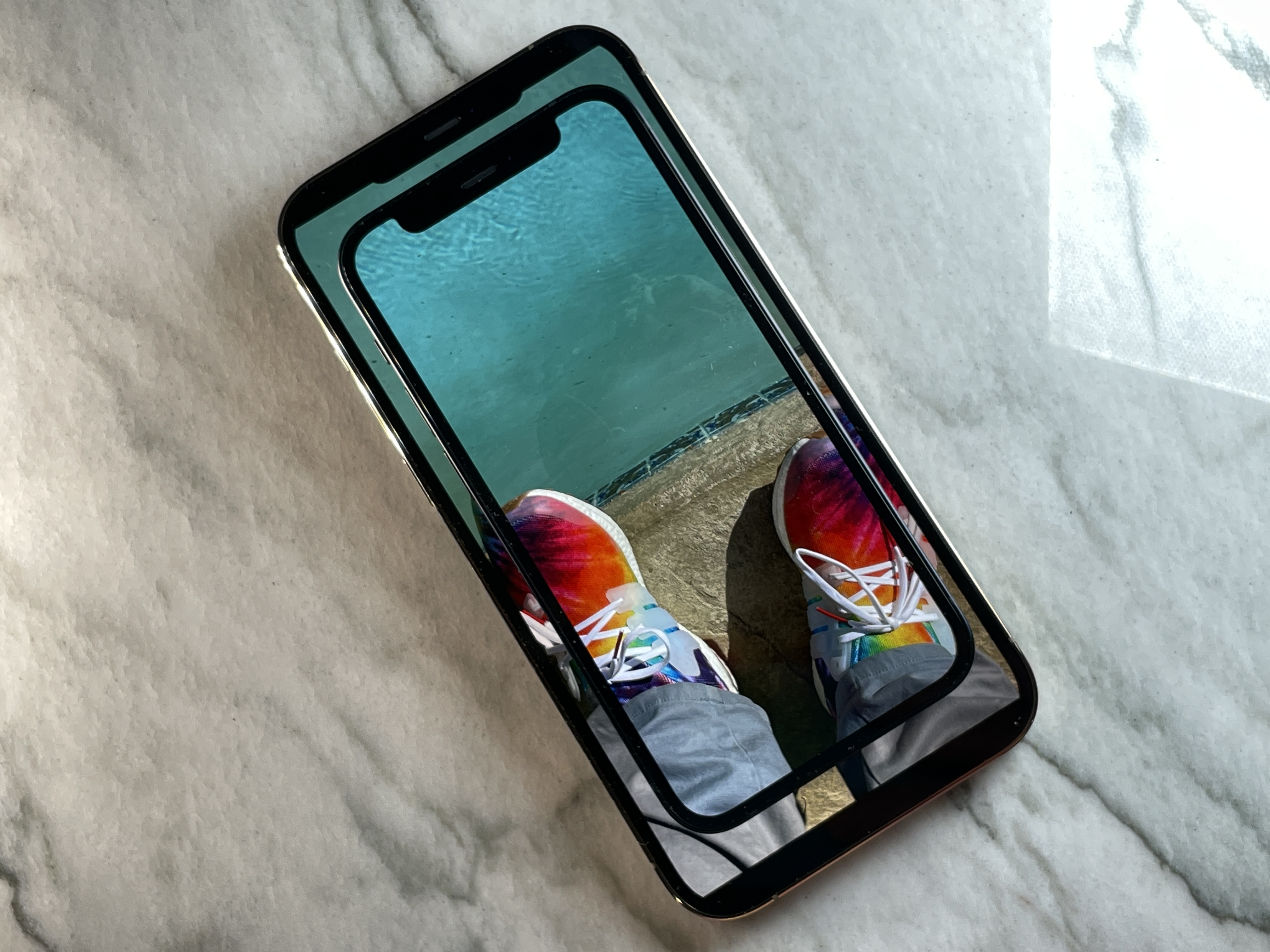 The iPhone 12 mini on top of an iPhone 12 Pro Max